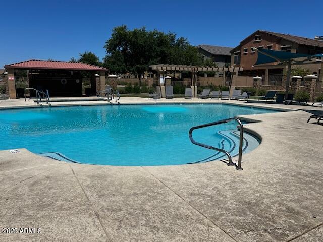 1350 S Greenfield Rd Unit 1219, Mesa, AZ 85206 - community pool featuring a pergola and a patio area