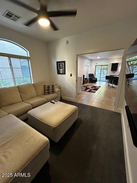 1350 S Greenfield Rd Unit 1219, Mesa, AZ 85206 - tiled living area with ceiling fan and baseboards