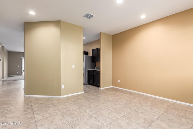 empty room with light tile patterned floors