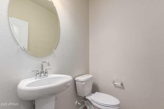 bathroom with sink and toilet