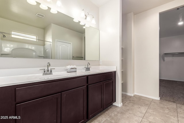 bathroom featuring tile patterned floors and vanity