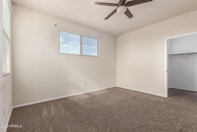 unfurnished bedroom featuring ceiling fan, a closet, and carpet flooring