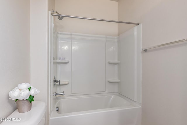 bathroom with toilet and shower / tub combination