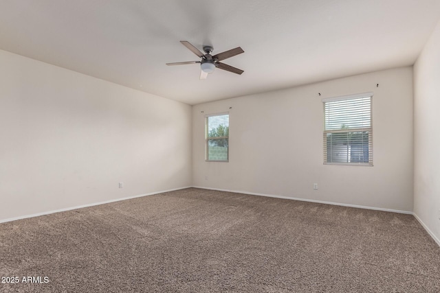 unfurnished room with ceiling fan, a healthy amount of sunlight, and carpet floors