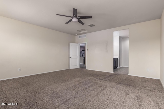 carpeted empty room featuring ceiling fan