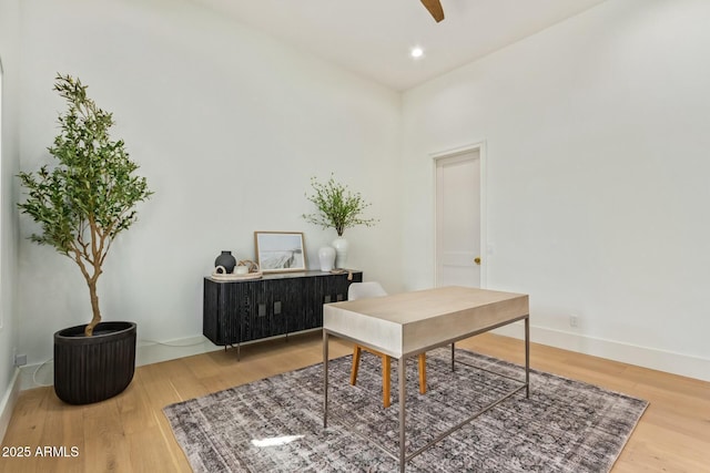 office featuring ceiling fan and wood-type flooring