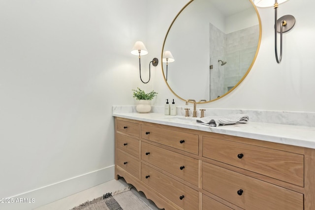 bathroom with tile patterned floors and vanity