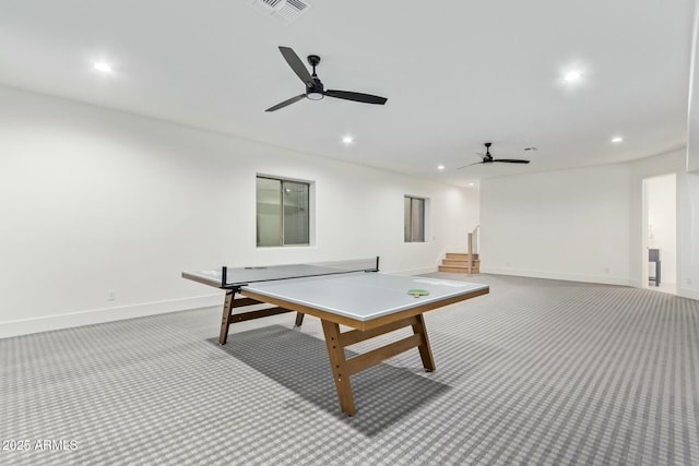 recreation room featuring ceiling fan and light colored carpet