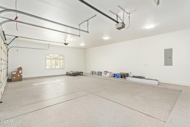 garage featuring a garage door opener and electric panel