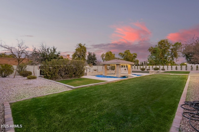 exterior space featuring a gazebo and a fenced in pool