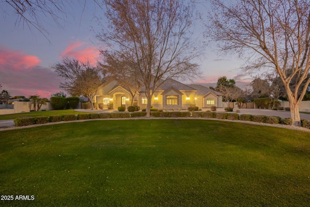 view of front of property with a lawn