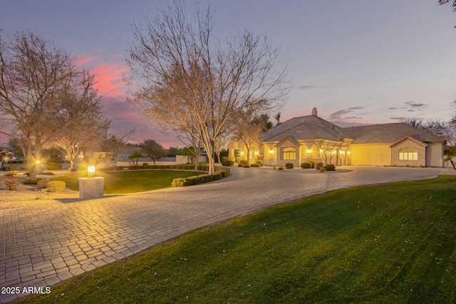 view of front of property with a lawn