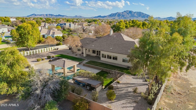 birds eye view of property featuring a mountain view