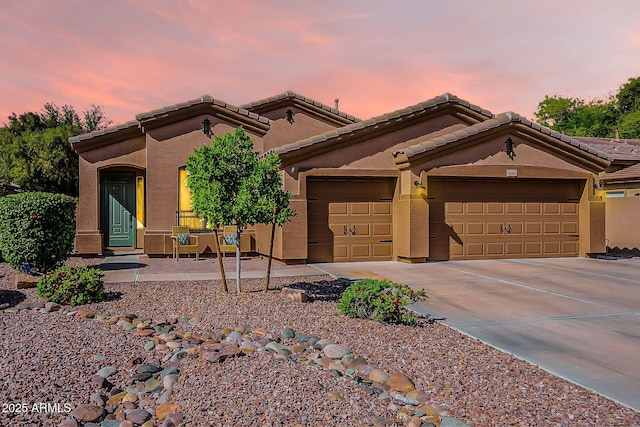 3662 E Megan St, Gilbert, AZ 85295 - view of front of house with an attached garage, stucco siding, driveway, and a tile roof