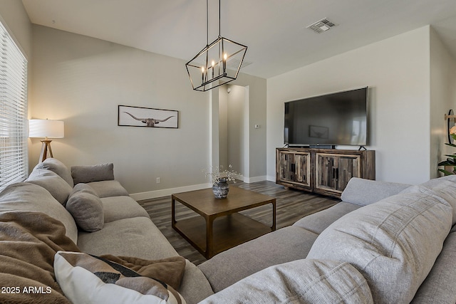 3662 E Megan St, Gilbert, AZ 85295 - living area with baseboards, a chandelier, wood finished floors, and visible vents
