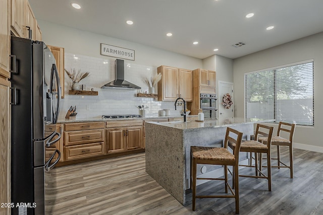 3662 E Megan St, Gilbert, AZ 85295 - kitchen featuring open shelves, wall chimney range hood, light wood-type flooring, recessed lighting, and appliances with stainless steel finishes