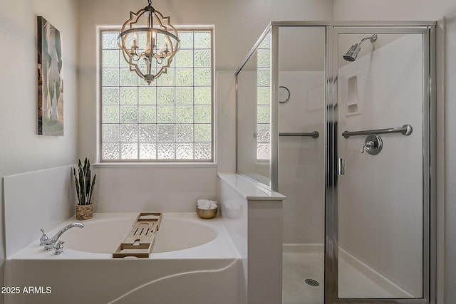 3662 E Megan St, Gilbert, AZ 85295 - full bathroom featuring a bath, a stall shower, and a notable chandelier