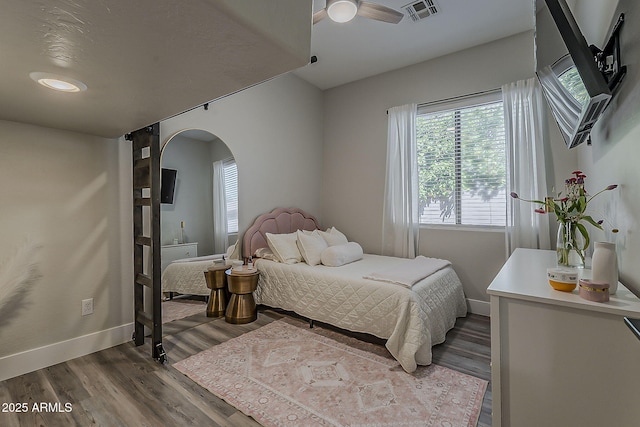 3662 E Megan St, Gilbert, AZ 85295 - bedroom with visible vents, arched walkways, baseboards, and dark wood-style floors