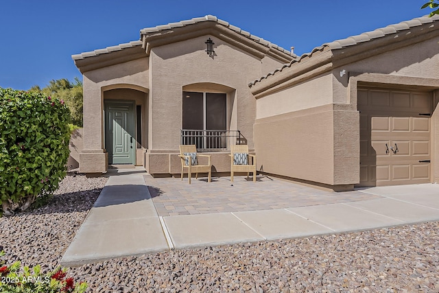 3662 E Megan St, Gilbert, AZ 85295 - entrance to property featuring a garage, a tile roof, and stucco siding