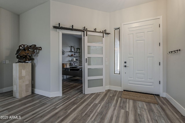 3662 E Megan St, Gilbert, AZ 85295 - foyer featuring baseboards, a barn door, and wood finished floors