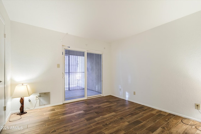 empty room with dark wood-type flooring