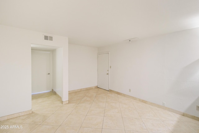 empty room featuring light tile patterned floors