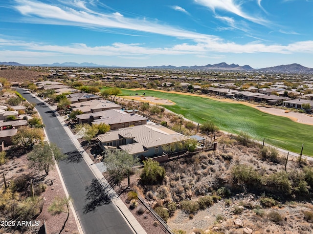 aerial view featuring a residential view, a mountain view, and golf course view