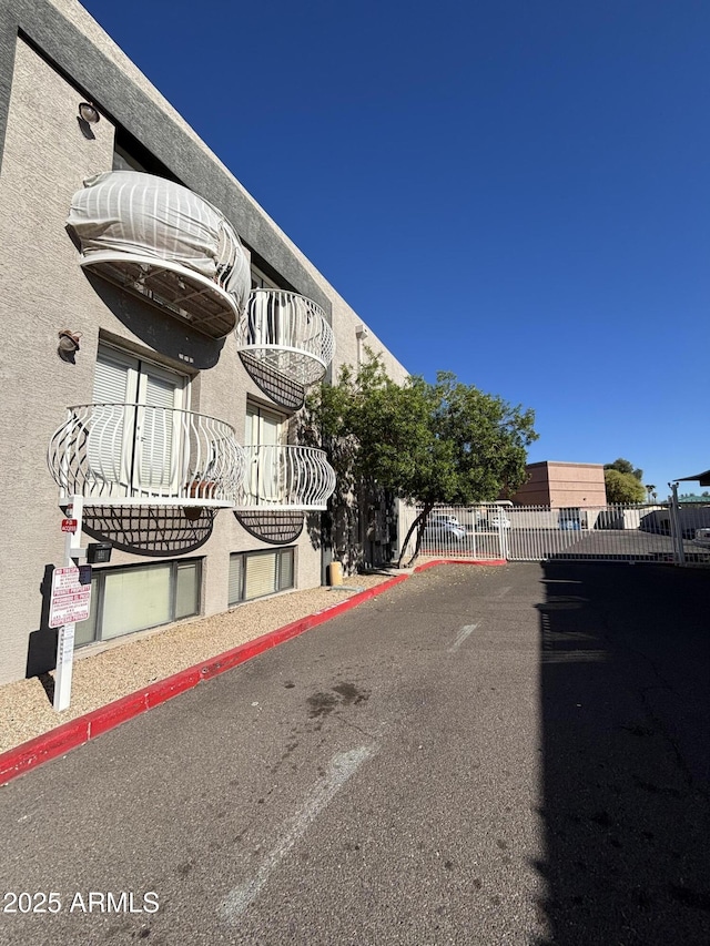 view of property with fence
