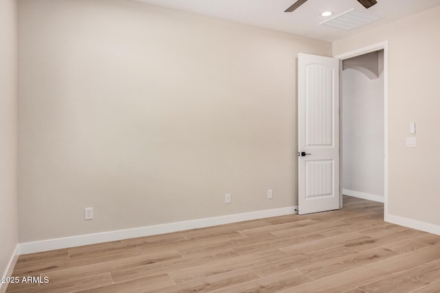 unfurnished room with ceiling fan and light hardwood / wood-style floors