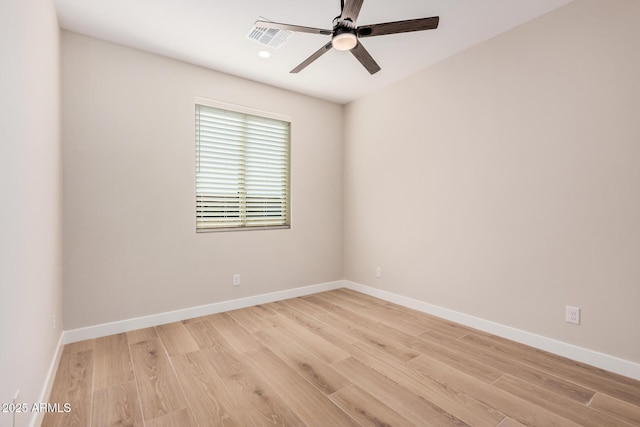 empty room featuring ceiling fan and light hardwood / wood-style floors