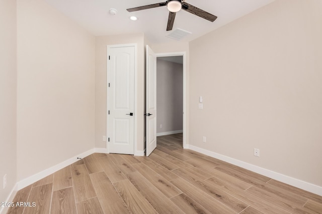 unfurnished bedroom with light hardwood / wood-style floors and ceiling fan