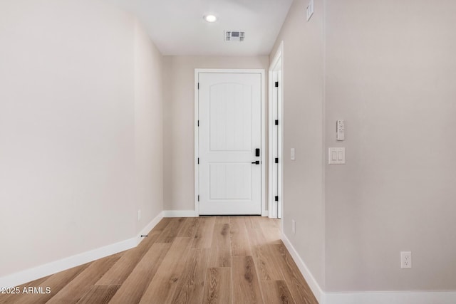 corridor featuring light wood-type flooring