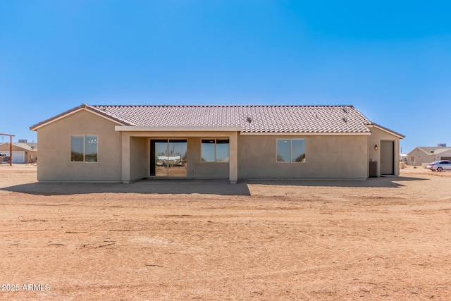 rear view of property featuring a patio area