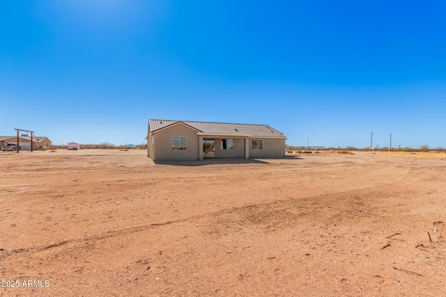 view of front of property with a rural view