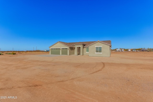 view of front of property featuring a garage