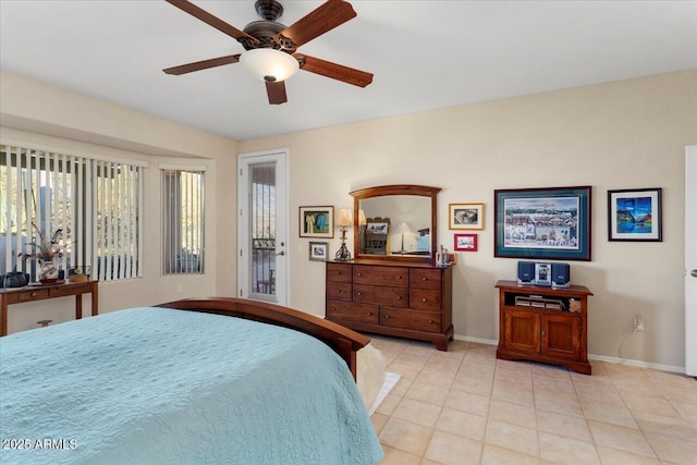 tiled bedroom featuring ceiling fan