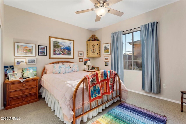 carpeted bedroom with a ceiling fan and baseboards