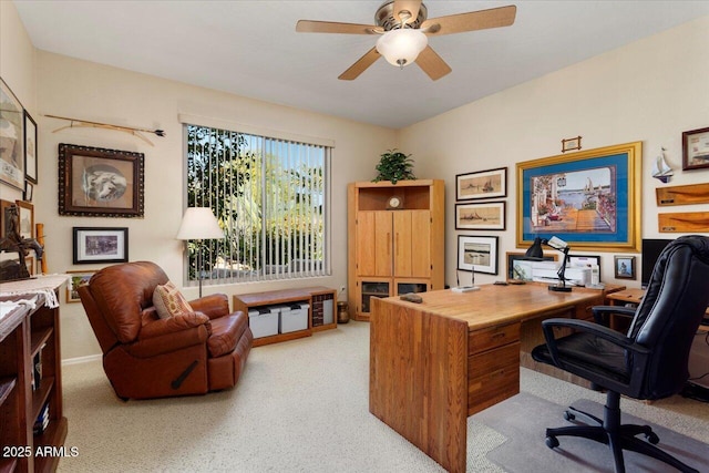 office featuring ceiling fan and light carpet