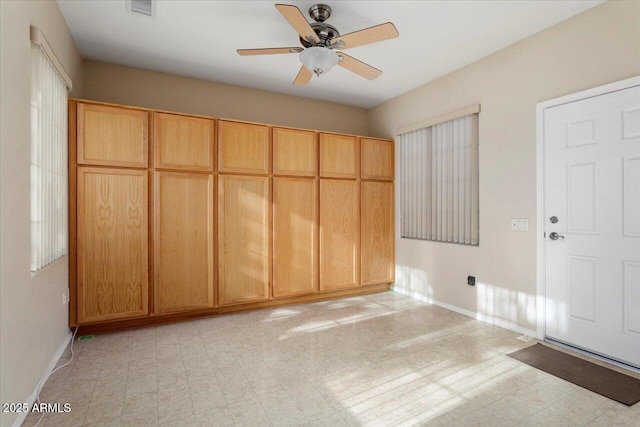 unfurnished bedroom featuring ceiling fan