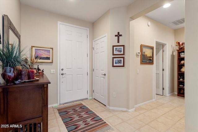 foyer with visible vents and baseboards