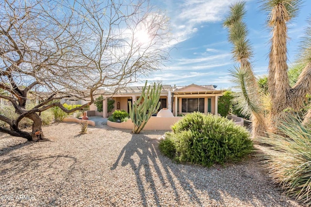 adobe home with stucco siding