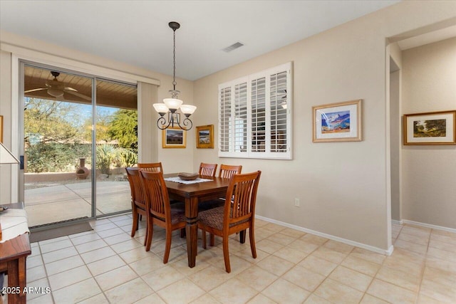 tiled dining space featuring an inviting chandelier