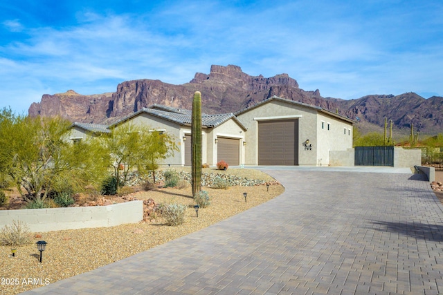 ranch-style home with a mountain view and a garage