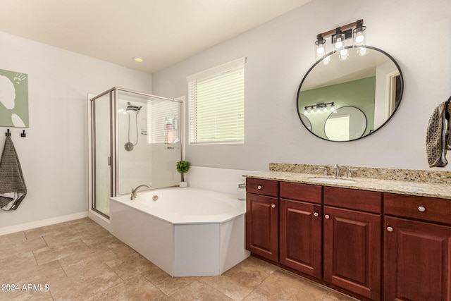 bathroom featuring plus walk in shower and vanity