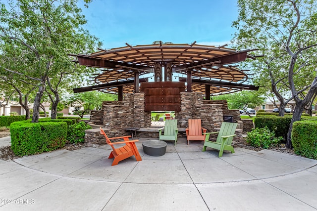 view of patio / terrace with an outdoor stone fireplace