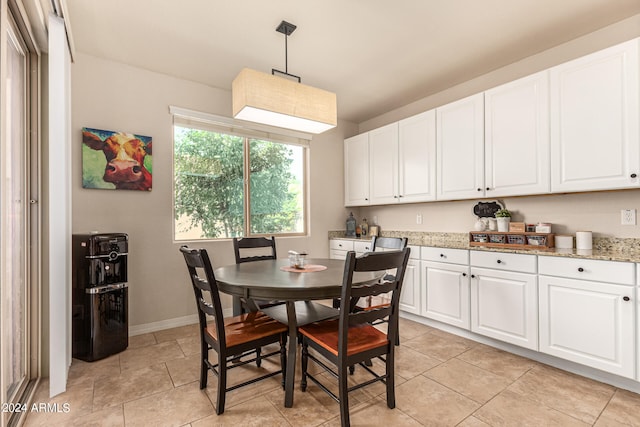 dining space featuring light tile patterned floors