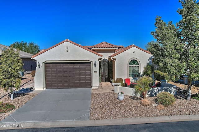 mediterranean / spanish-style house with a garage