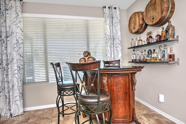 bar featuring tile patterned flooring