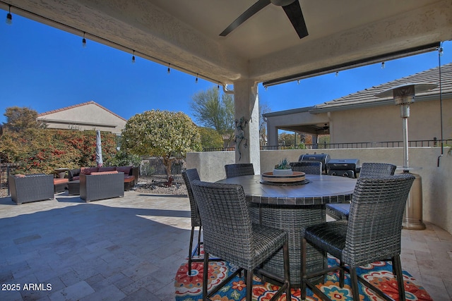 view of patio with grilling area, outdoor lounge area, and ceiling fan