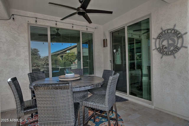 view of patio / terrace featuring ceiling fan